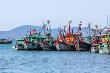 Row of Malaysian fishing boats at the bay close to Kota Kinabalu, Borneo, Malaysia