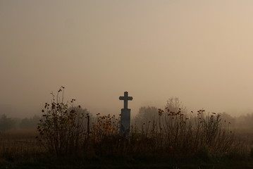 old grave in the misty morning