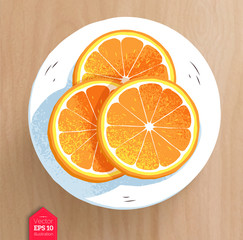 Slices of orange on wooden table background
