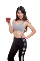 Beautiful healthy Asian girl with tomato juice.