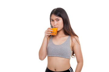 Beautiful Asian healthy girl drinking  orange juice.