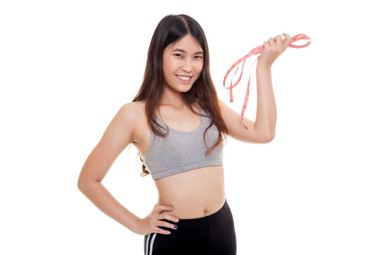 Beautiful Asian healthy girl with measuring tape.