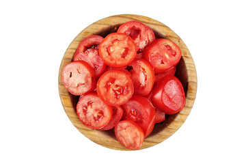 cut red tomatoes in a wooden plate
