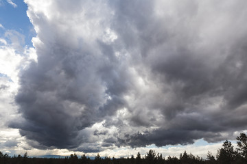 Dramatic Clouds Over Desert Landscape