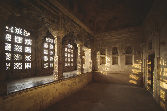 Sunlight through ornate windows in Jahangir Mahal, India
