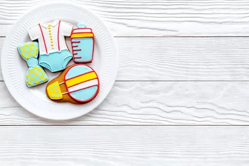 Tuinposter Cook gingerbread cookies on plate for baby shower on white wooden background top view mockup © 9dreamstudio