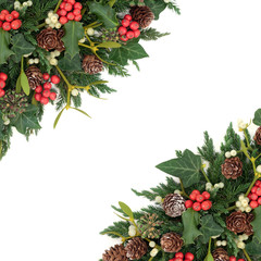 Winter and christmas border with holly, ivy, mistletoe, fir and pine cones on white background.