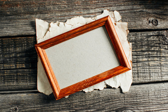 brown photo frame on the wooden table