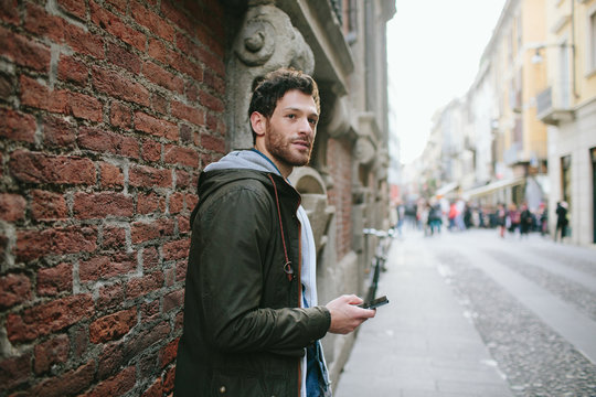 Young man using a smartphone in the street