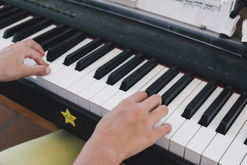 9 year old girl playing the electric piano