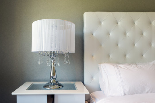 Contemporary bedside with white glitzy table lamp