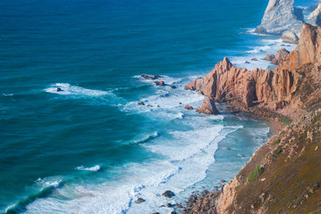 Ocean meets Cliffs of Cabo da Roca Cape Roca in Sintra - the westernmost extent of mainland Portugal and Europe.
