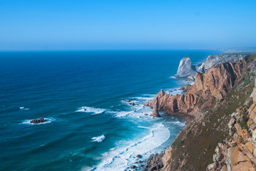 Ocean meets Cliffs of Cabo da Roca Cape Roca in Sintra - the westernmost extent of mainland Portugal and Europe.