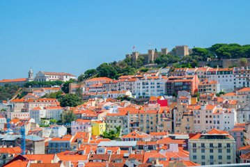Fototapeta na wymiar Panoramic view of Lisbon city, Portugal orange bright roofs in a suuny day