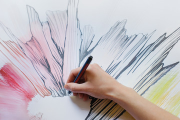 Close Up of Female Hand Drawing Original Artwork With Black Felt Pen