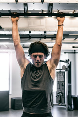 Workspace: Man Doing Pullups In Office Fitness Center