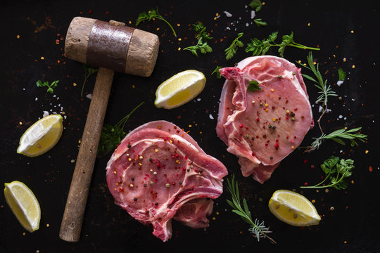 Seasoned raw pork steaks