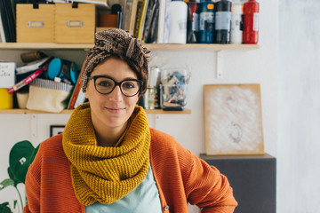 Attractive Young Artist Woman Wearing Headscarf Standing in Her Studio