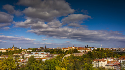 Fototapeta premium Lighten Prague during nice sunny day. Clear blue sky over czech landmarks. Aerial view on Prague.