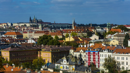 Fototapeta na wymiar Lighten Prague during nice sunny day. Clear blue sky over czech landmarks. Aerial view on Prague.