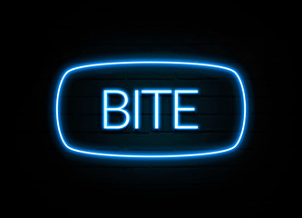 Bite  - colorful Neon Sign on brickwall