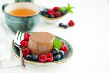 Delicious home-made chocolate dessert Panna cotta. Cream-caramel, caramel custard, with figs.
