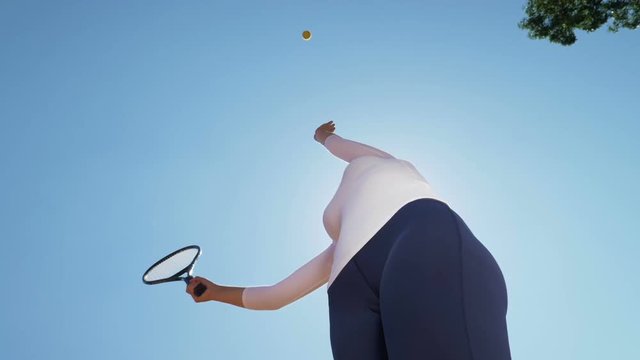 Tennis player throws and catches a ball seen from below