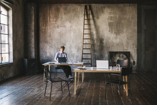 Businessman working in a contemporary loft office
