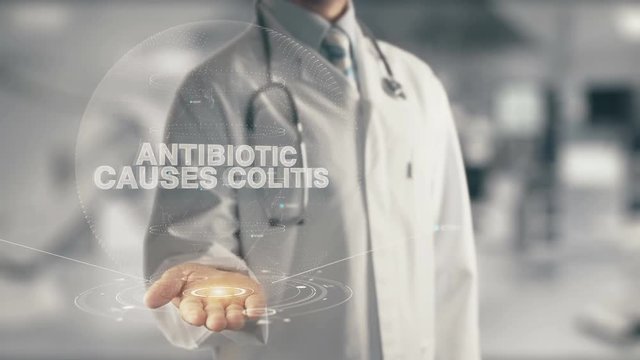 Doctor holding in hand Antibiotic Causes Colitis