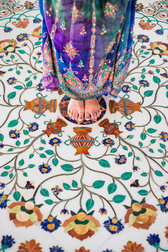 Woman Barefoot Standing On Floral Floor