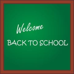 Back to school. Inscription on the green blackboard