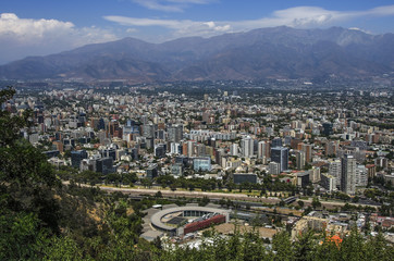 Obraz premium Aerial view of a city and The Andes mountain in the background, Santiago, Chile
