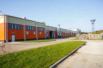 Obraz premium Plastic bales at the waste processing plant. Separate garbage collection. Recycling and storage of waste for further disposal. Business for sorting and processing of waste.