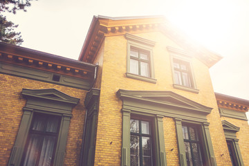 Fototapeta premium old brick residential building in summer