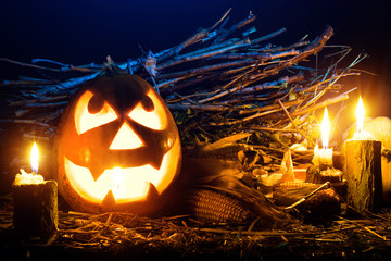 Photo for the holiday Halloween. Evil pumpkin lamp background