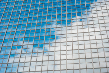 glass facade with cloud reflections