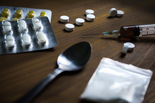 Man Substance Dependence Medication Drug Syringe And Cooked Heroin