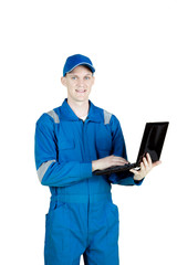 Friendly mechanic works with a laptop on studio