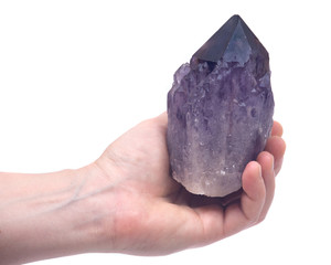 Woman's hand holding Ametrine lightbrary point from Bolivia isolated on white background 