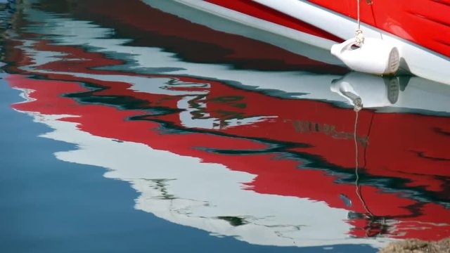 Reflection of Yacht board in water