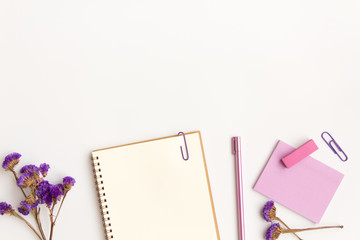 notebook paper, pen and purple dry flowers on white background