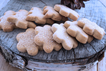 Christmas cookies against the old tree background. Christmas and New Year background. Close-up. Selective focus. Horizontal.