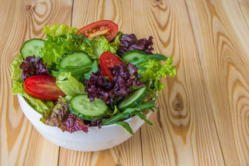 Fresh salad with mixed greens, cherry tomato and cucumber