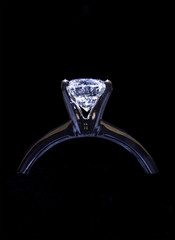 Close up Diamond Engagement Ring Isolated on black background