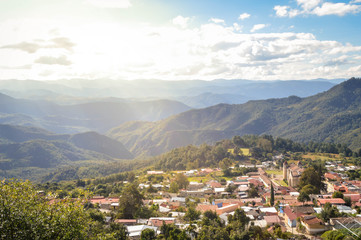 Fototapeta premium The panoramic landscape of Capulalpam de Mendez village in the highlands of Oaxaca, Mexico. It is one of the “Pueblos Magicos” towns