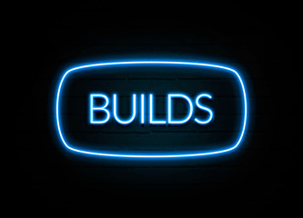 Builds  - colorful Neon Sign on brickwall