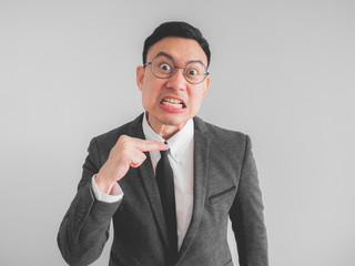 Angry boss manager businessman in black suite.