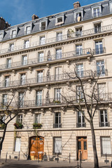Paris, typical facade in the center, beautiful building in summer 
