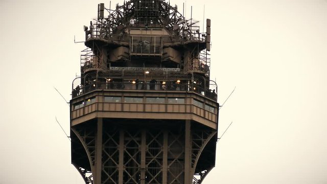 Observation deck on the top of the Eiffel tower in Paris, France. Telephoto lens shot