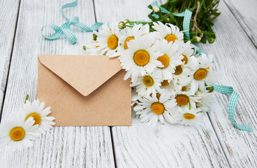 bouquet of daisies with envelope